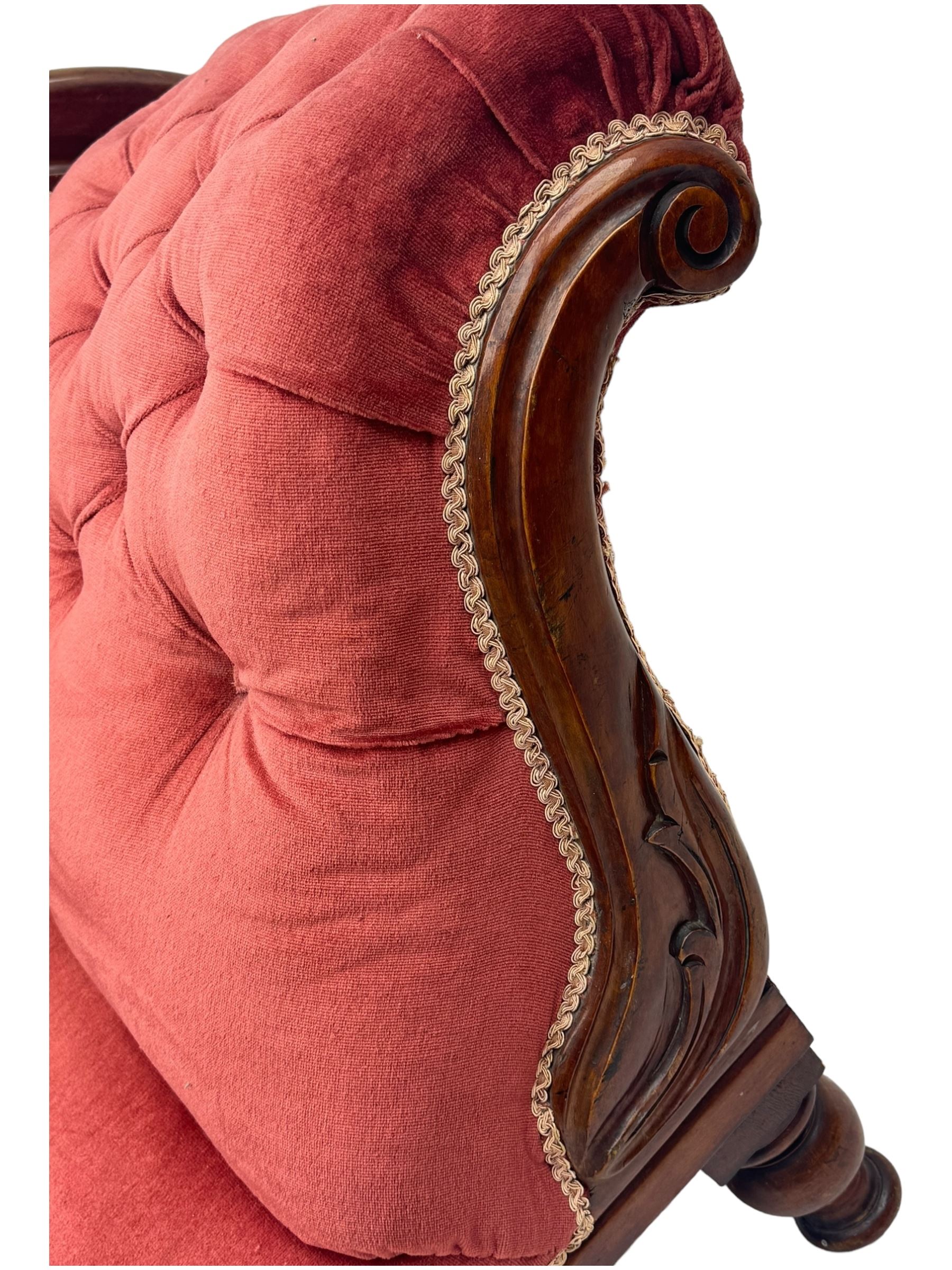 Victorian mahogany framed chaise longue, upholstered in pink velvet, the scrolled back with button-tufting, on turned feet