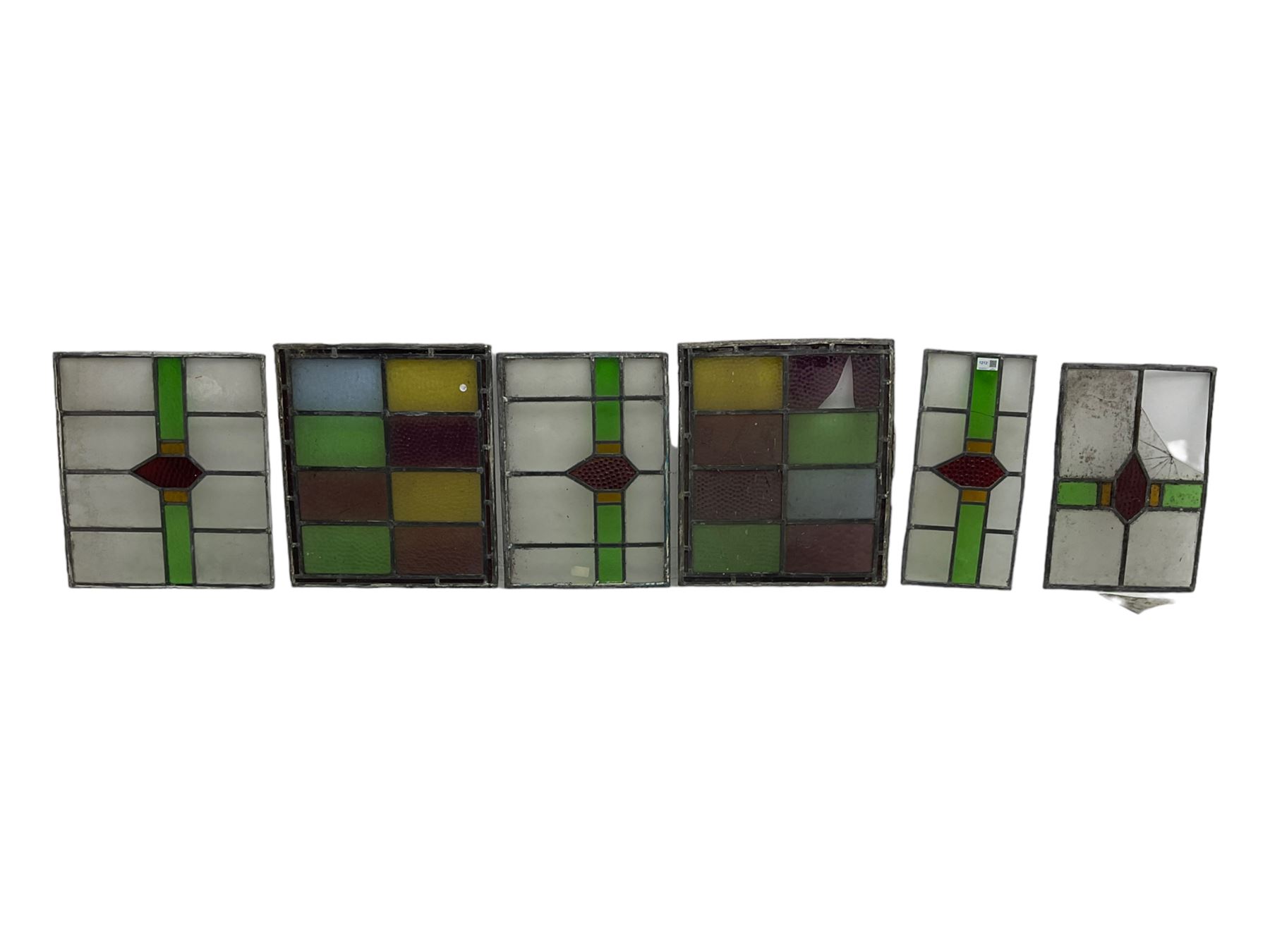 Six leaded stained glass window panes, largest measuring - 46cm x 41cm