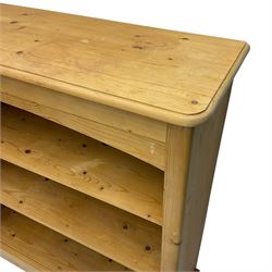 Pine open bookcase, fitted with two adjustable shelves, on plinth base