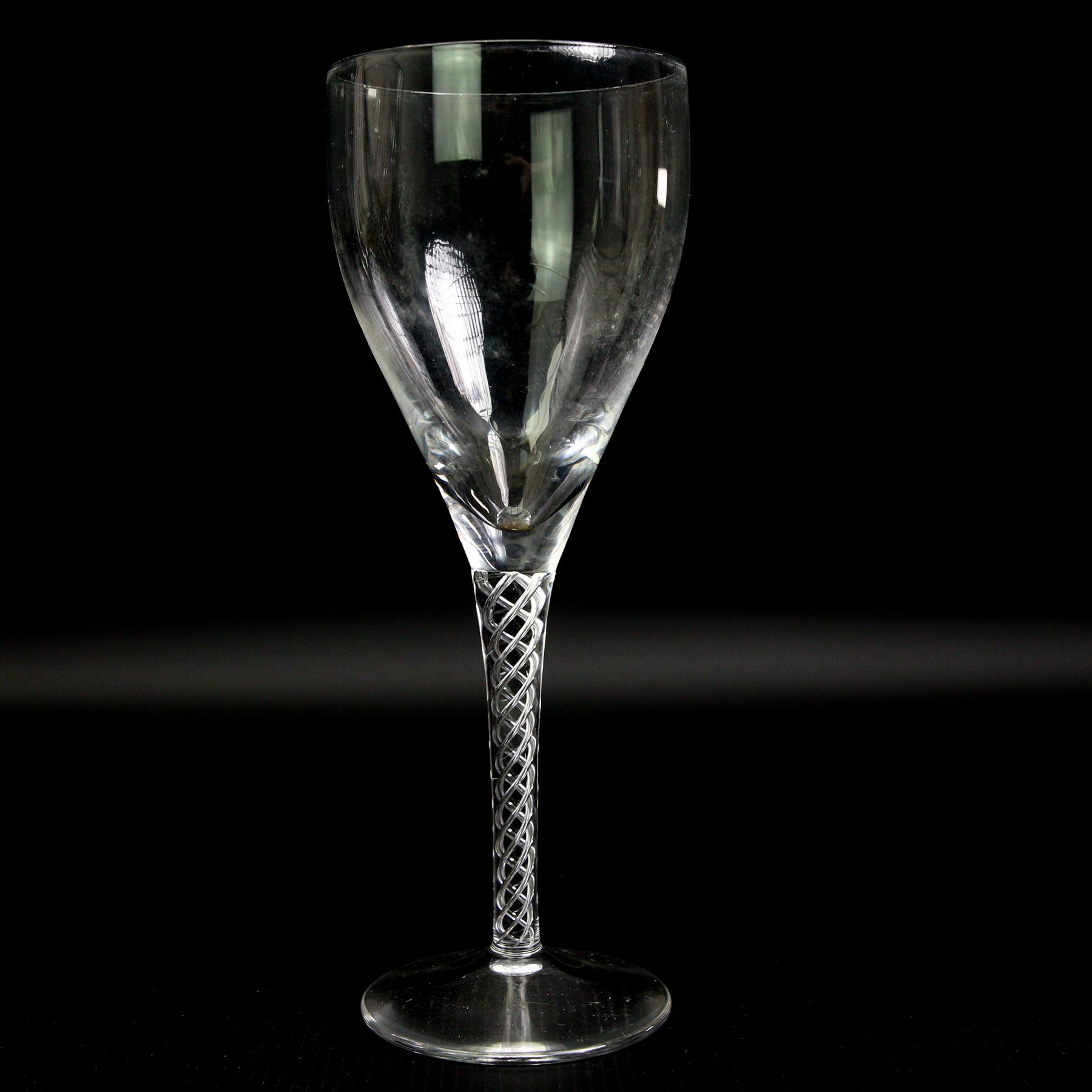 Part suit of Stuart Ariel drinking glasses comprising eight champagne flutes, six white wine glasses and two red wine glasses, together with a Saint Louis heavy cut glass vase, H25cm