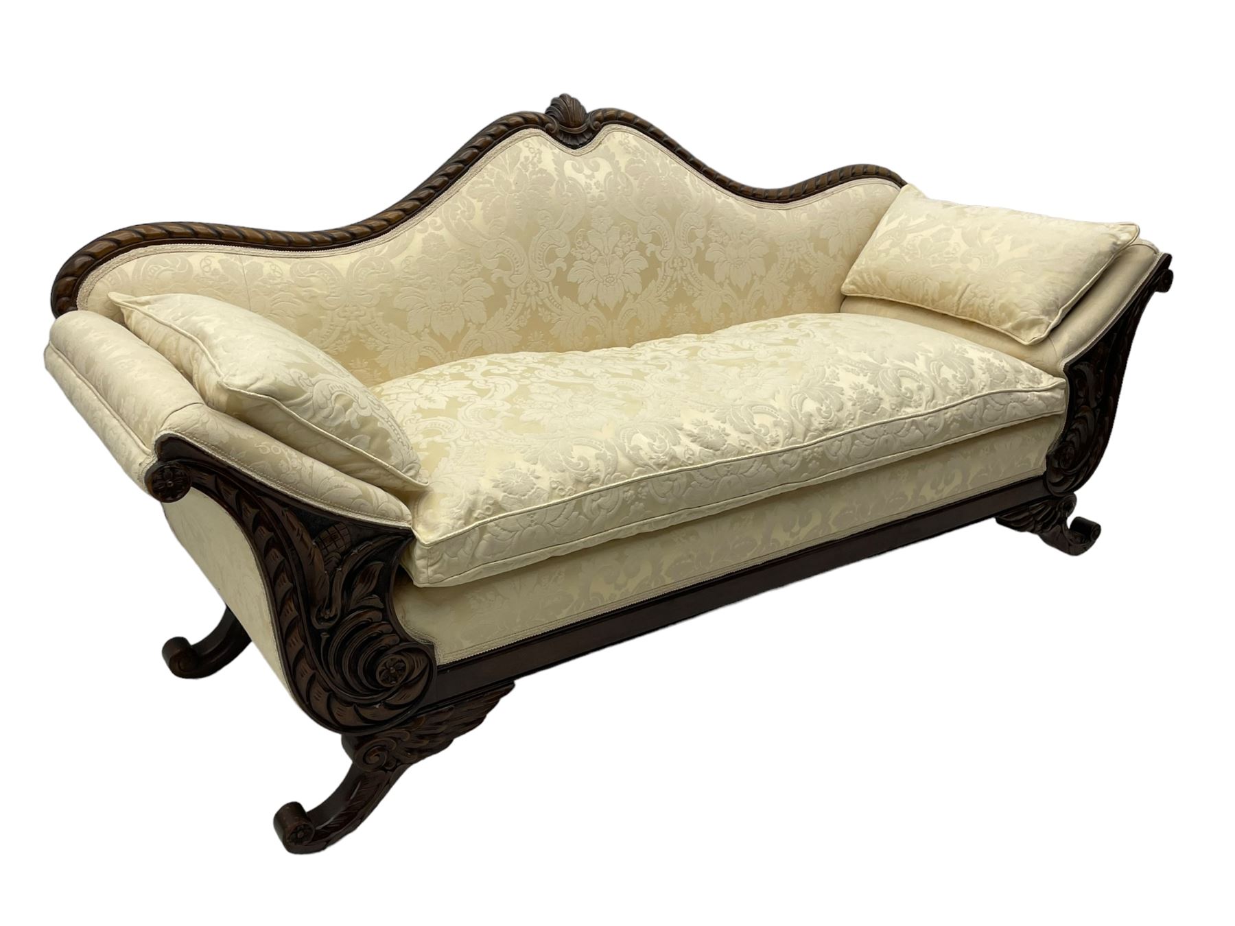 Victorian design walnut framed settee, shaped camelback with gadroon carved edge and central feather motif, upholstered in cream damask fabric with scrolling floral pattern, S-scroll arm facias carved with flower head and curled leaves, feather carved C-scroll splayed feet 