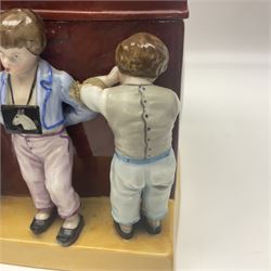 19th century Continental jar and cover, modelled as a classroom, with the teachers desk as the cover, H27cm