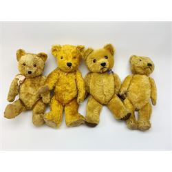 Four teddy bears 1930s - 1950s comprising Chiltern type with gold plush body, revolving head with clear glass eyes and vertically stitched nose and mouth, jointed limbs with velvet pads and card lined feet H18.5