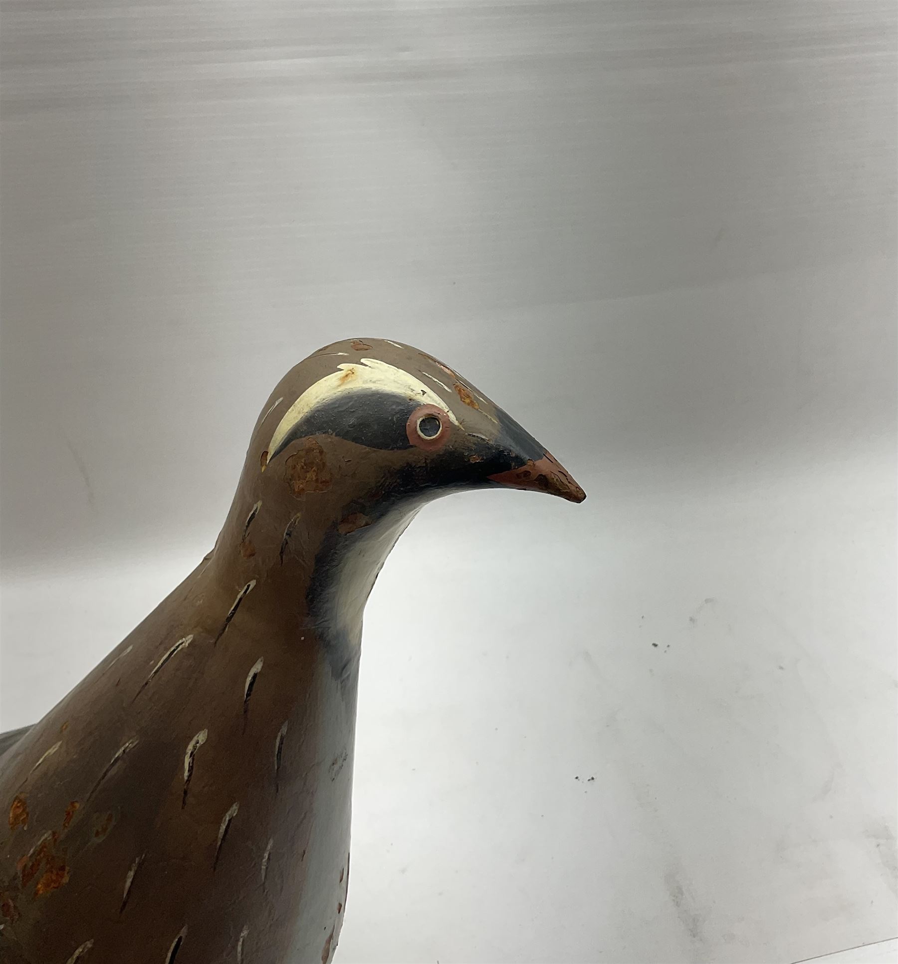 Early 20th century cold painted metal decoy bird, modelled as a Partridge, H34cm L55cm