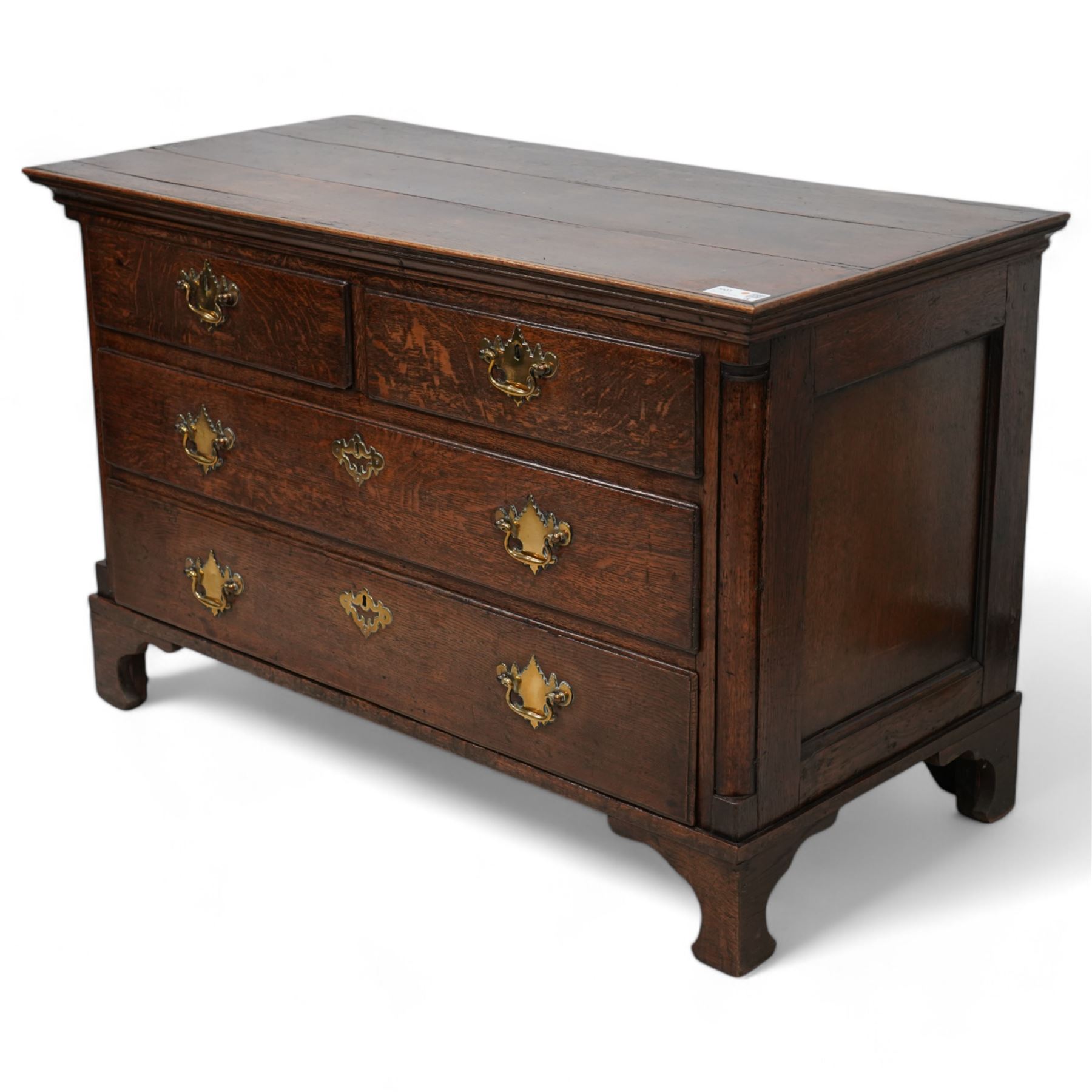 18th century oak chest, rectangular protruding top with moulded edge, fitted with two short over two long drawers, flanked by quarter-canted plain pilasters, raised on shaped bracket feet