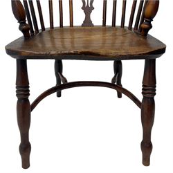 19th century yew wood and elm Windsor armchair, low double hoop stick and pierced splat back, dished seat on turned supports united by crinoline stretchers