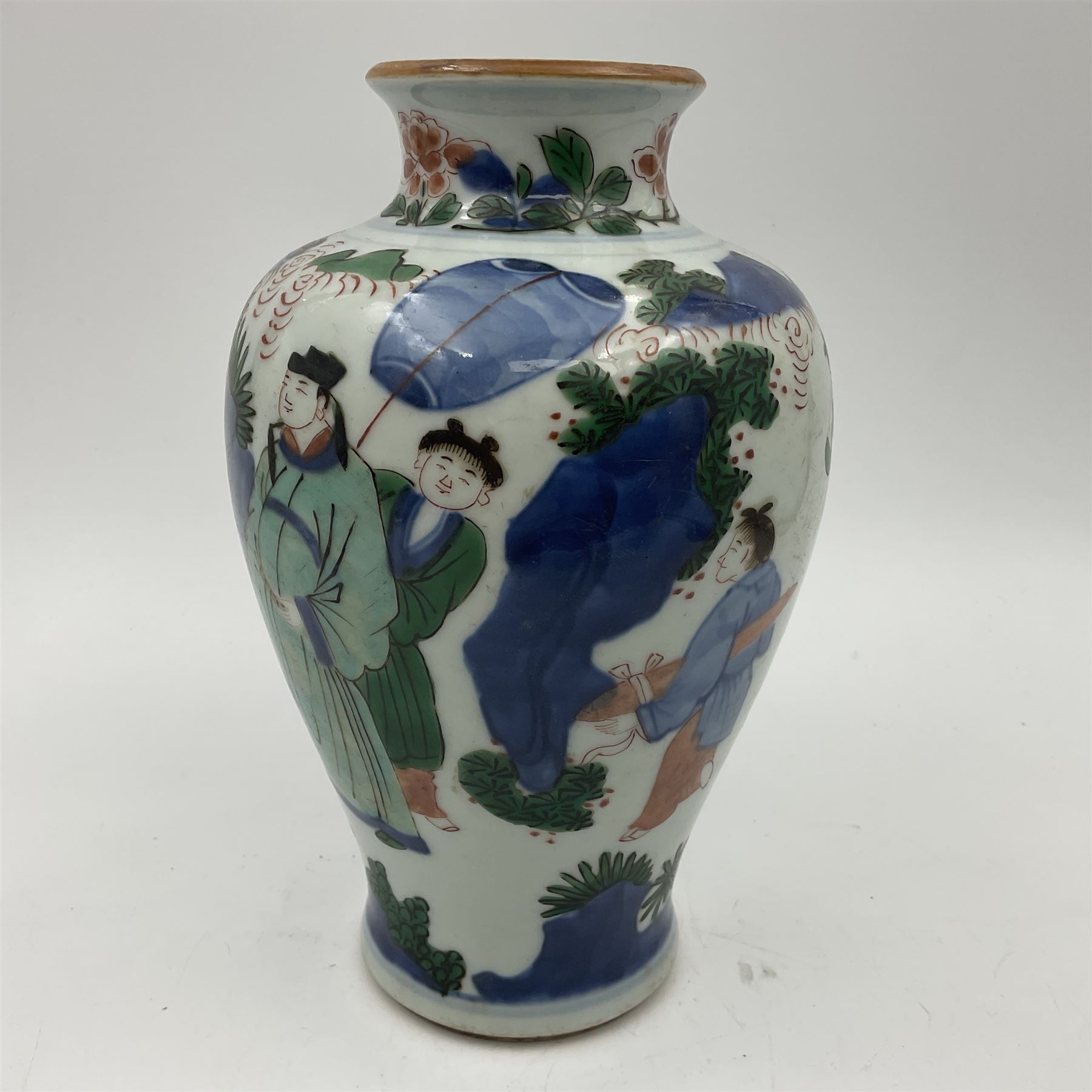 Chinese Wucai vase, of baluster form, decorated with an official and attendants in a garden setting, with crane, fence and rockwork, H19cm