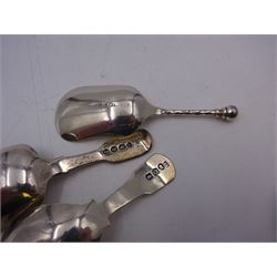 Three silver caddy spoons, comprising George III Fiddle pattern example, William IV Fiddle pattern example with later engraved bowl. and shovel example with twist handle, hallmarked some elements indistinct