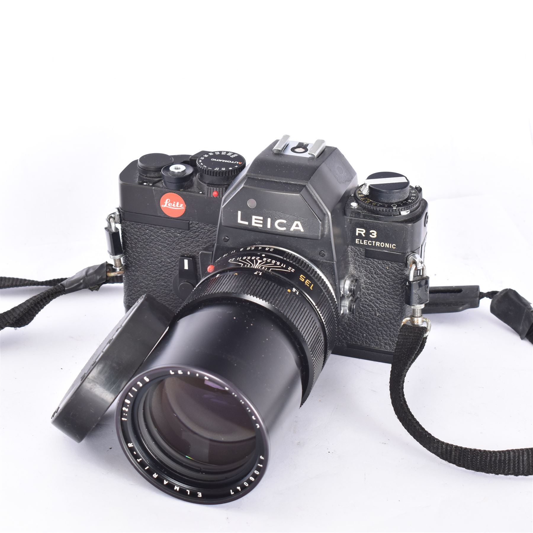 Leica R3 Electronic SLR camera body, in black finish, serial no. 1488884, made in Portugal 1977, with Leitz Canada Elmarit-R 1:2.8/135 lens, serial no. 3106047, with Leitz lens cap