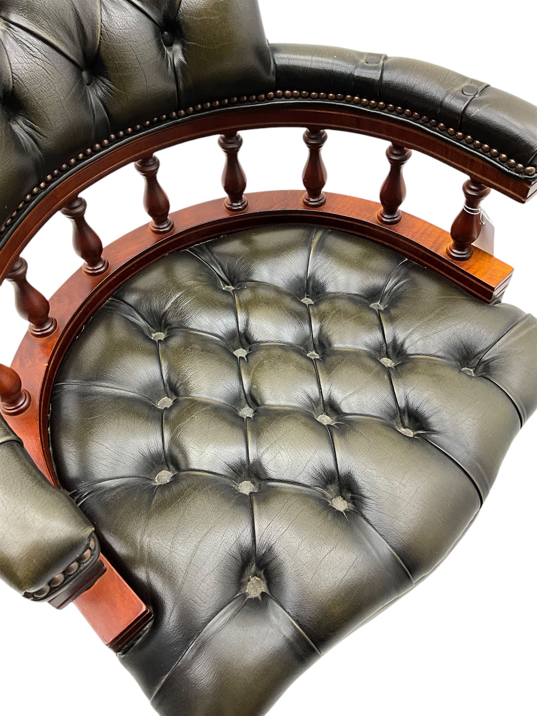 Captain's standard desk chair, upholstered in studded green leather