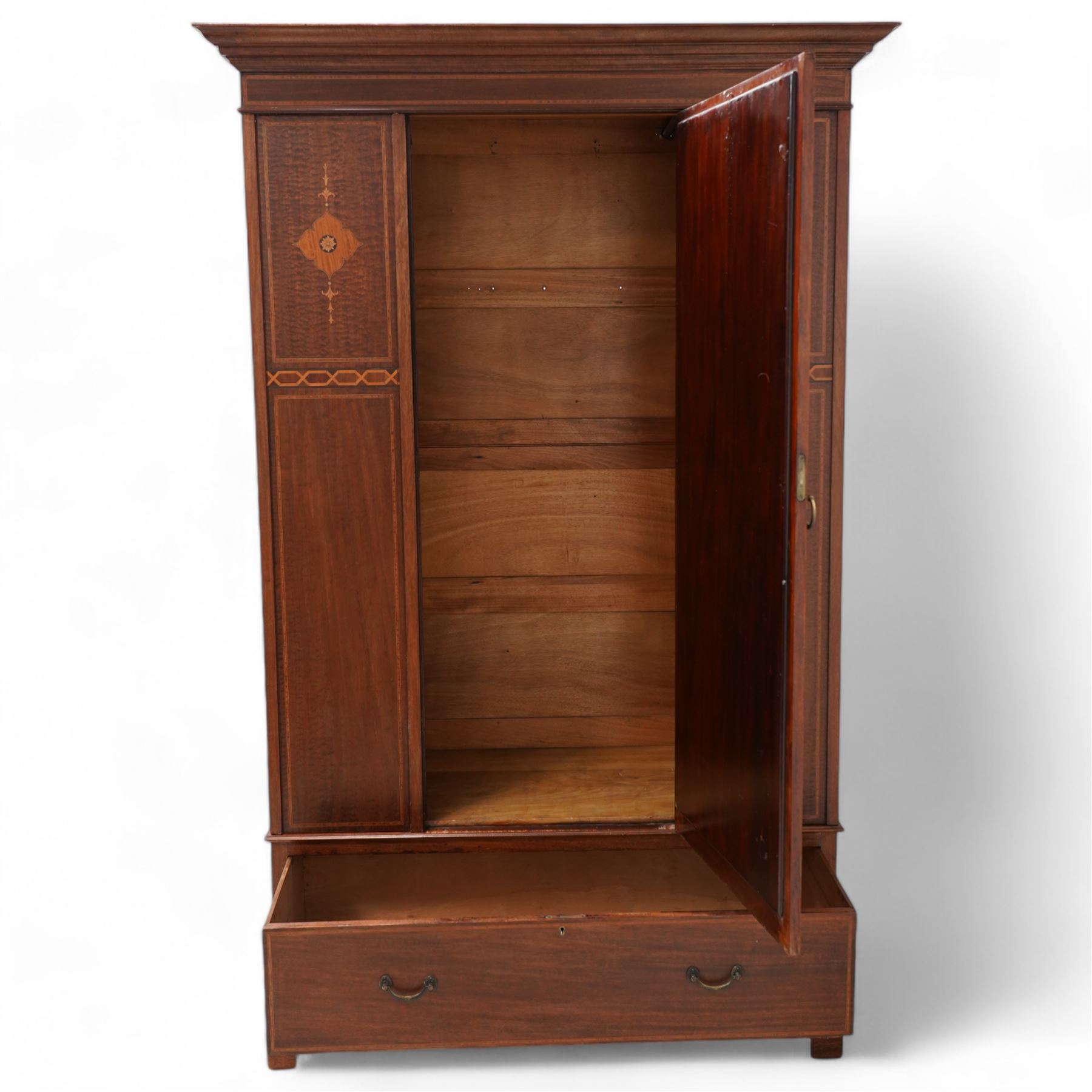 Edwardian inlaid mahogany wardrobe, projecting moulded cornice over panelled front and central bevelled mirror door, inlaid with satinwood shaped panels and trailing bell flowers, geometric inlaid bands and satinwood bands, single drawer to base, on bracket feet 