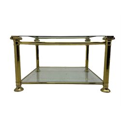 Mid 20th century brass and glass coffee table, square glass top with bevelled edges over undertier, supported by brass columns joined by crossbars, on circular feet