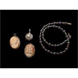 Beaded necklace with a 10ct gold clasp, two silver cameo brooches, and a silver trinket pendant