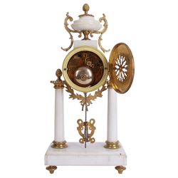 French - Louis XV style white marble and gilt mounted 8-day portico clock garniture c1905, drum movement surmounted by an oval shaped urn, supported on a pair of tapered column supports and raised on a rectangular plinth base, white enamel dial with floral garlands and Arabic numerals, Louis XV style gilt hands within a glazed bezel, twin train countwheel striking movement, striking the hours and half hours on a bell, with a pair of conforming three light candelabra, decorative matching pendulum and key.