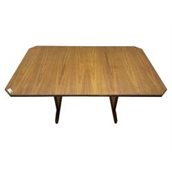 G-Plan -  1970s teak extending dining table, pull-out extending action with fold-out leaf, rectangular end supports on sledge feet united by stretcher (100cm x 160cm - 205cm, H73cm); set of six dining chairs, chevron-patterned backrests upholstered with floral patterned fabric, on tapered legs, H89cm