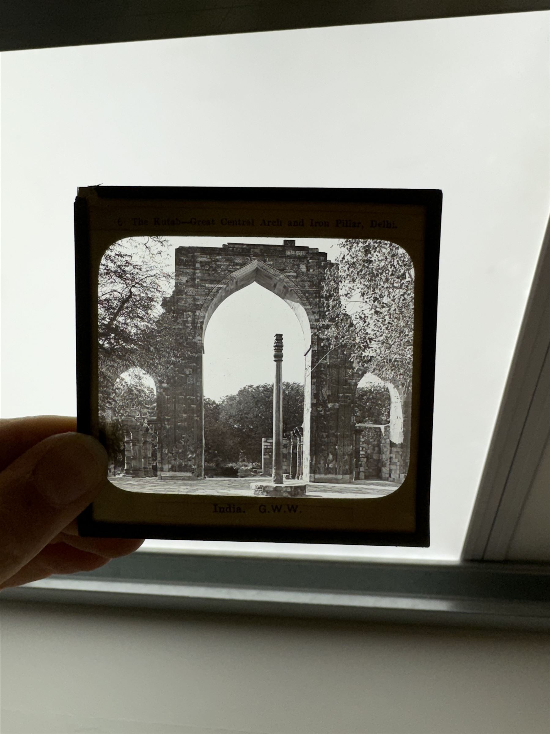 Collection of magic lantern slides, predominantly depicting views of India, with scenes including including the Taj Mahal, tombs, monuments, street scenes, people and animals, in compartmentalised wooden case 