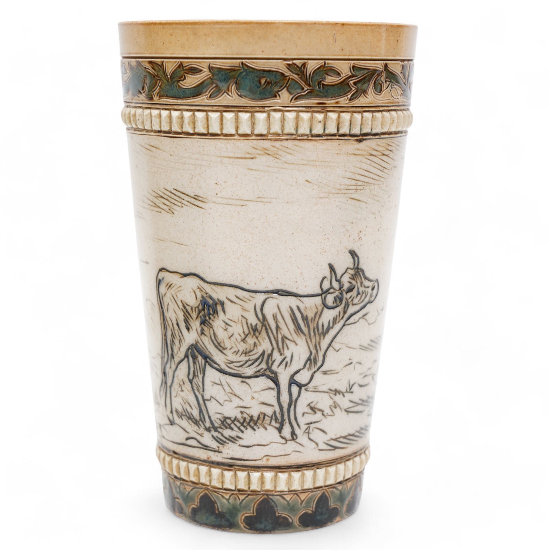 Late 19th century Doulton Lambeth sgraffito jug and beaker by Hannah Barlow, decorated with bands of cattle in landscapes between foliate boarders, with impressed and incised marks beneath, including monogram H24cm (2)