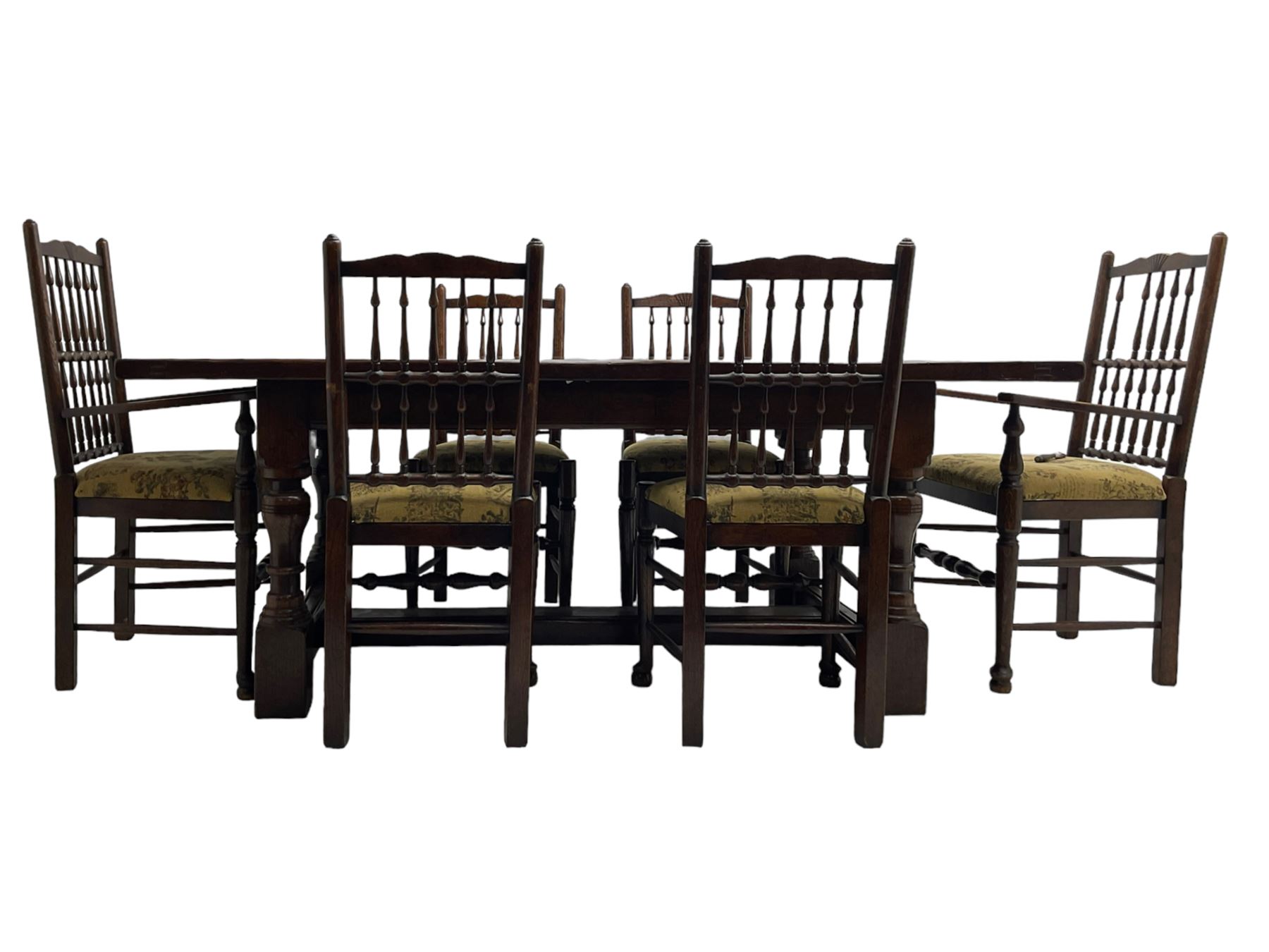 Oak refectory dining table, rectangular cleated top on turned supports joined by H-stretcher; together with set of six (4+2) oak spindle back dining chairs, with upholstered drop-on seat cushions, turned supports joined by turned stretchers