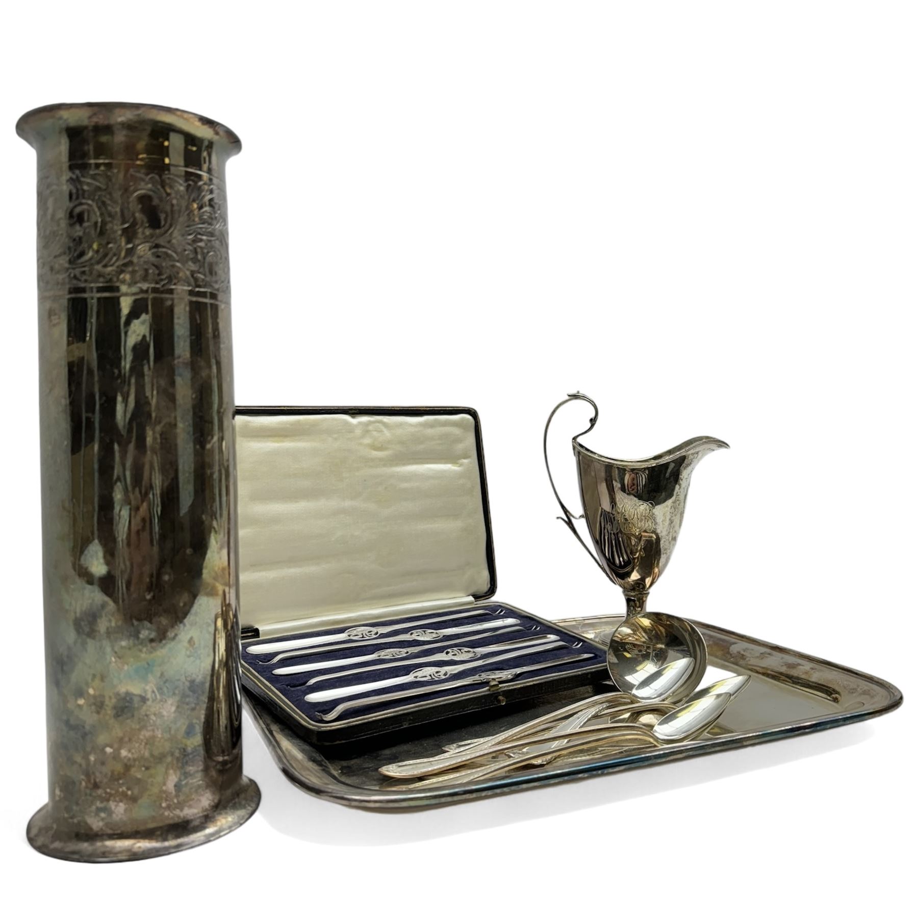 Group of silver plate, comprising vase of cylindrical form, H30.5cm, cream jug of helmet form, including handle H18.5cm, tray of oblong form, L35.5cm, and cased set of six lobster picks