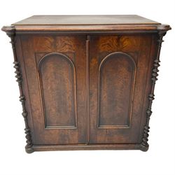 Victorian lacquered mahogany cupboard, fitted with two arch panelled doors enclosing two shelves, flanked by split turned uprights