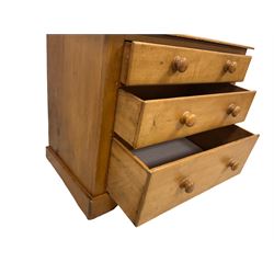 Victorian pine and satinwood chest, fitted with three graduating drawers, on skirted base with castors