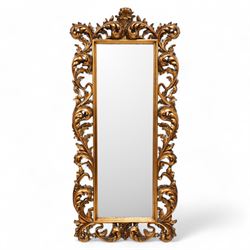 Gilt framed Florentine design wall mirror, bevelled mirror plate enclosed by trailing and ...