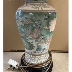 Oriental style table lamp, of baluster form, decorated with landscape scenes, with fabric shade, overall H70cm