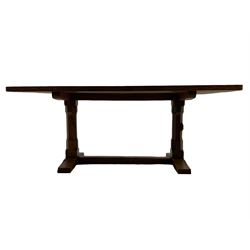 Rabbitman - oak dining table, rectangular adzed top, twin octagonal pillar supports on sledge feet, united by floor stretcher, carved with rabbit signature, by Peter Heap of Wetwang 