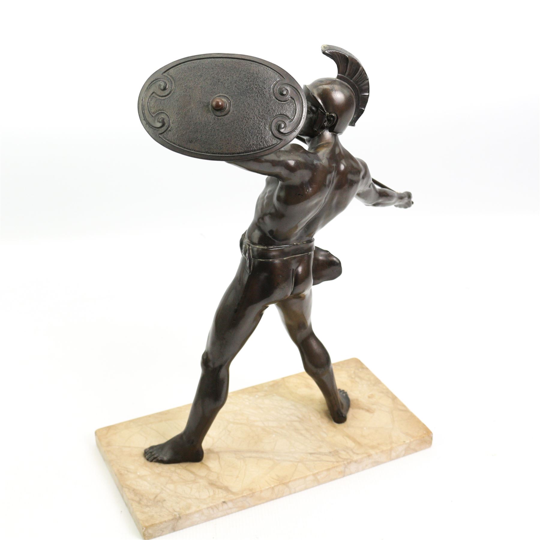 20th century patinated spelter model of a Spartan warrior holding a spear and shield, upon a rectangular marble plinth, H38cm x W28cm 