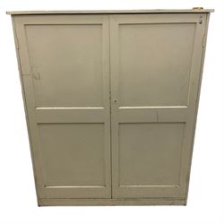 Large Victorian white painted pine cupboard, enclosed by two panelled doors 