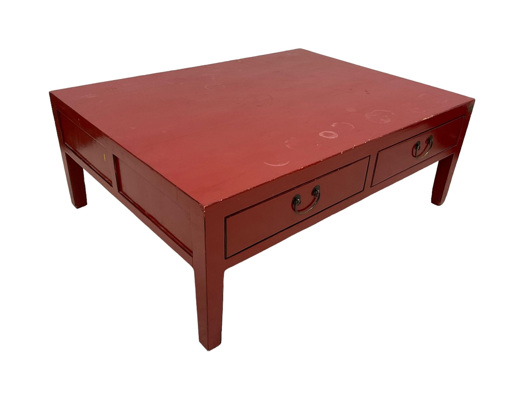 Chinese design red lacquered coffee table, rectangular form on square tapering supports, fitted with two drawers 