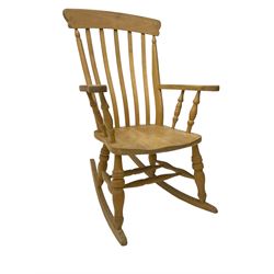 Farmhouse style beech rocking chair, shaped cresting rail on vertical slats, on turned front supports joined by swell-turned double H stretcher base