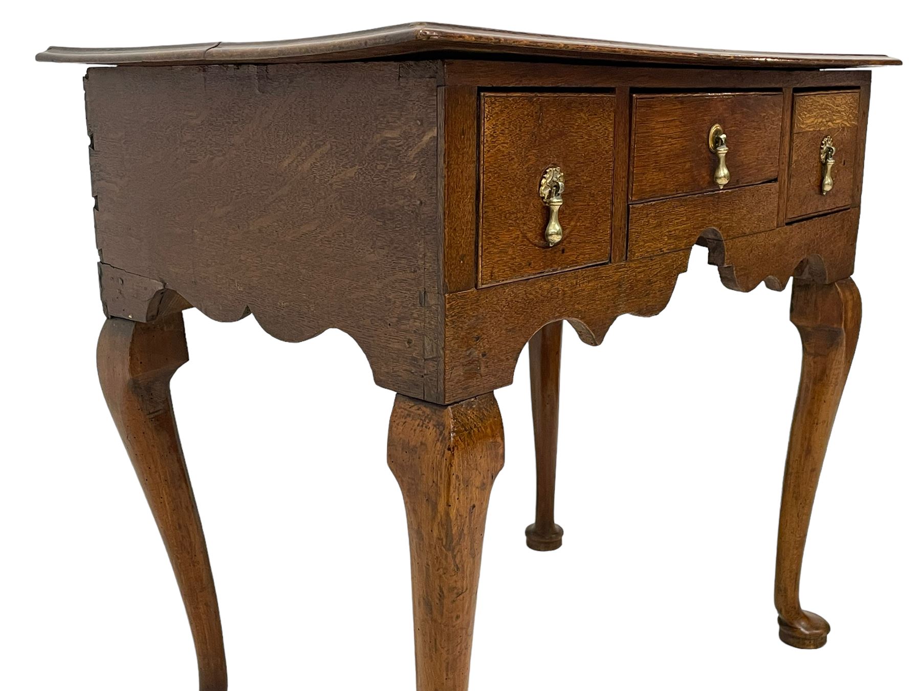 18th century oak low-boy, rectangular moulded top over three drawers with scratch mouldings, shaped apron, on cabriole supports