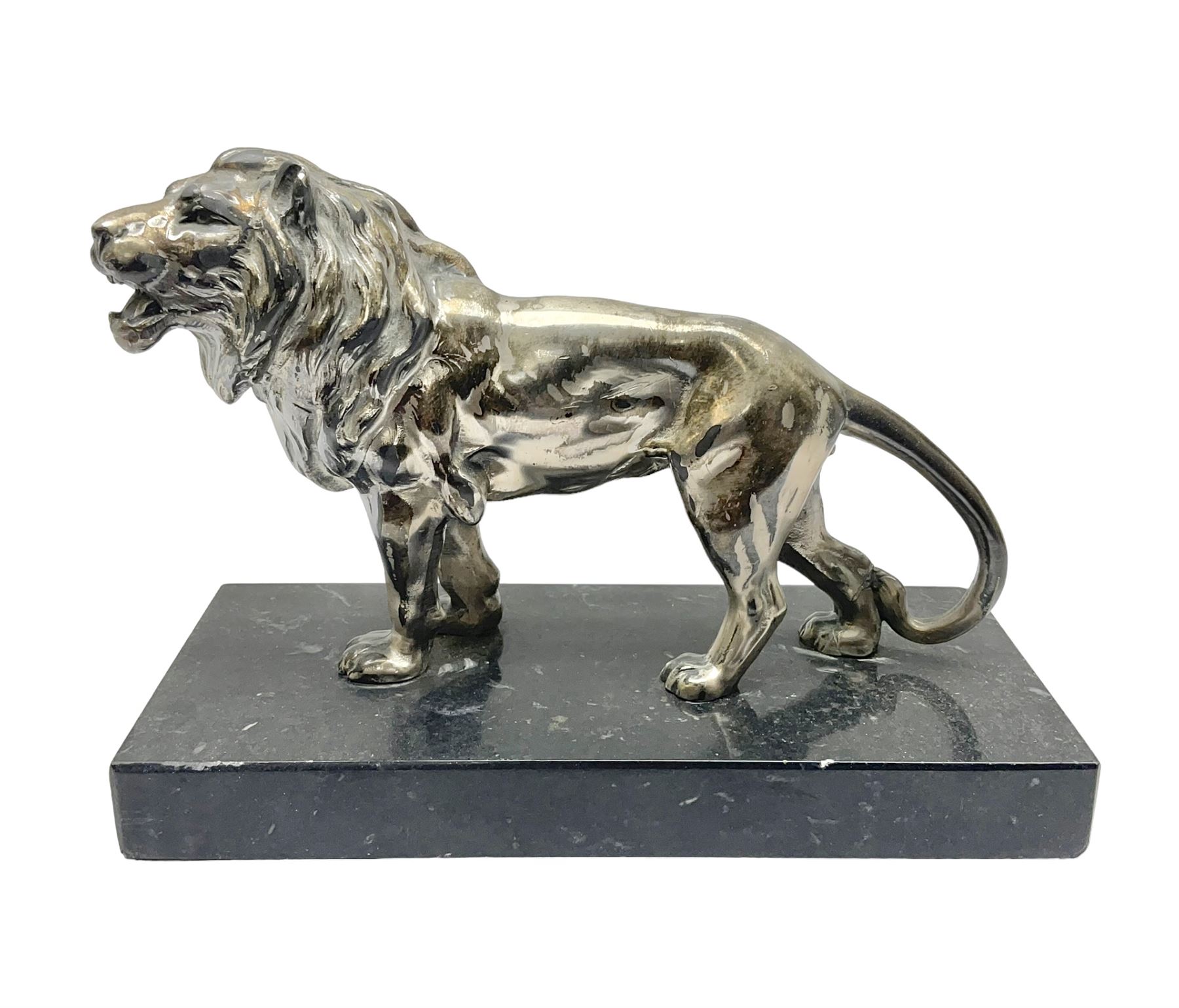 Silvered metal lion, upon a rectangular base, H12cm