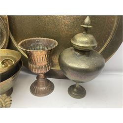 Collection of oriental brass and other metal ware, to include to large chargers, pair of covered urns, hoho bird, etc, largest charger D63cm