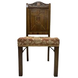 19th century walnut side chair, foliage carved cresting rail over geometric inlaid back with central panel depicting buildings, upholstered seat, on moulded and chamfered square supports