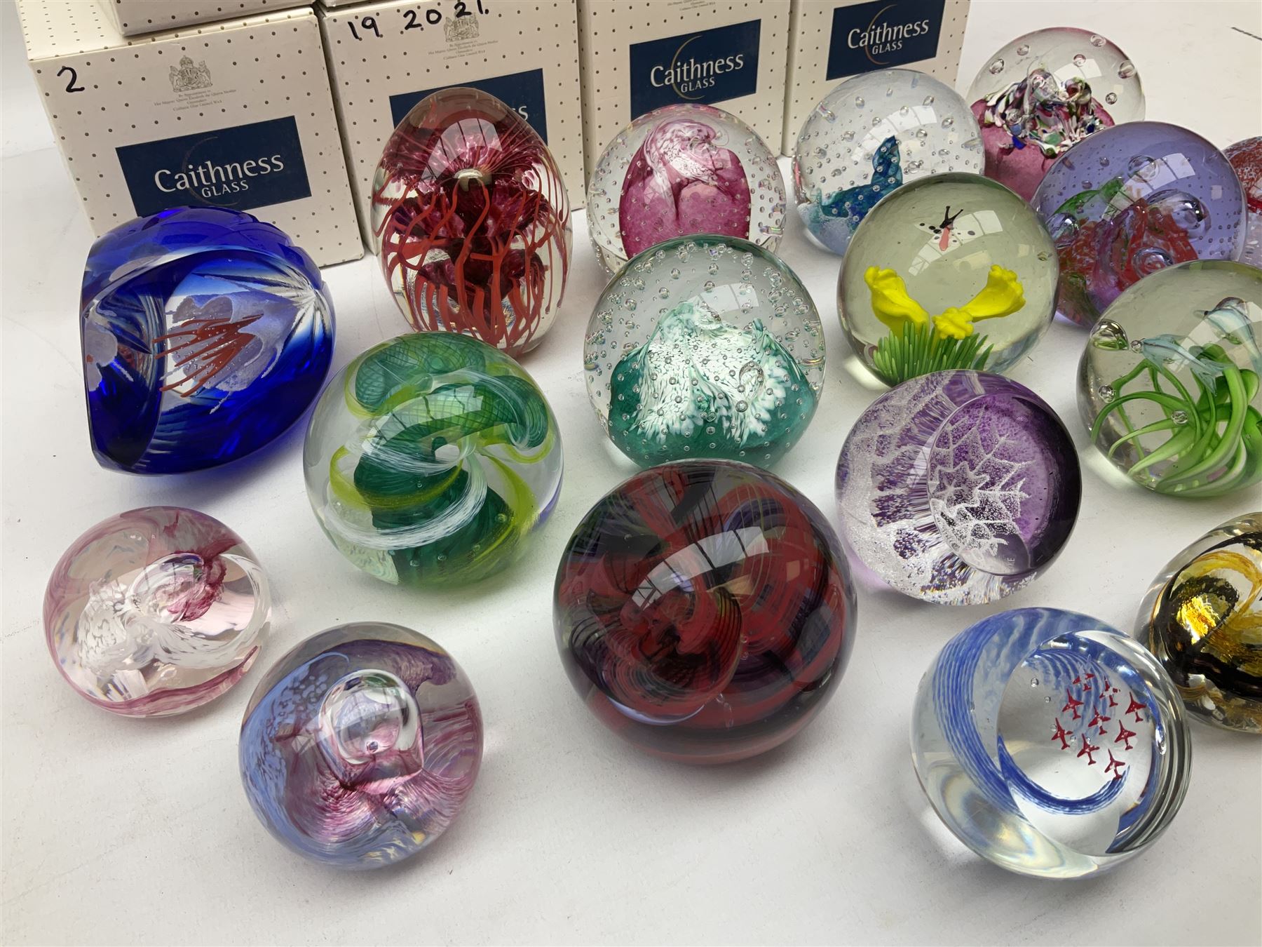 Eighteen Caithness paperweights, to include Myriad, Escapade ...