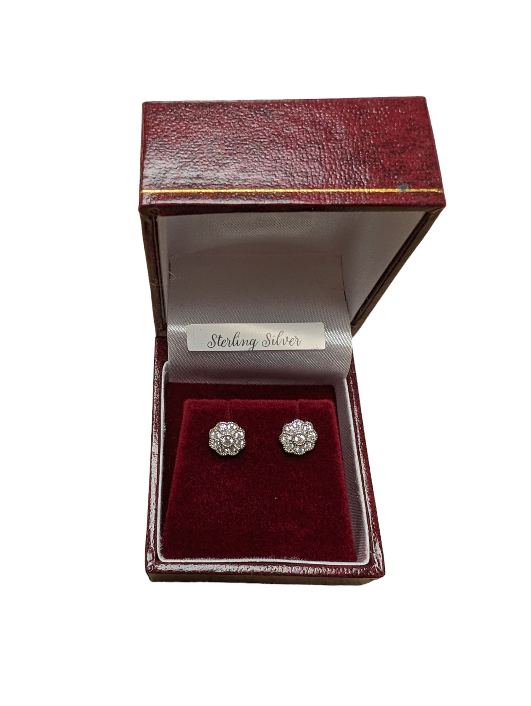 Pair of silver cubic zirconia flower stud earrings, stamped 925, boxed 