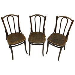 Set of three late 19th to early 20th century century bentwood dining chairs, the seats with pressed anthemion decoration, circa. 1900s