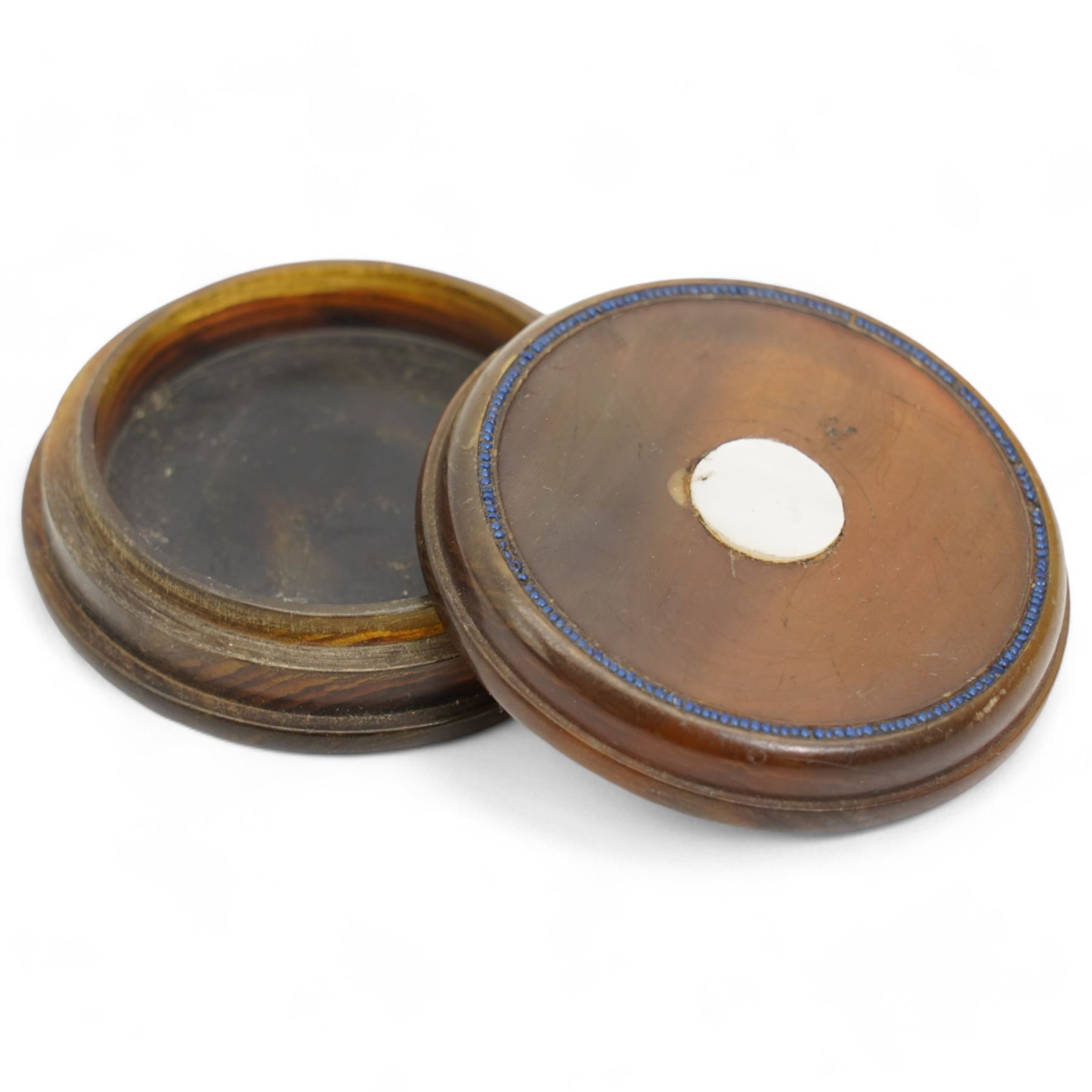 19th century French pressed horn circular box, the cover with a geometric design D6.5cm  and one other horn box with mother of pearl roundel (2)