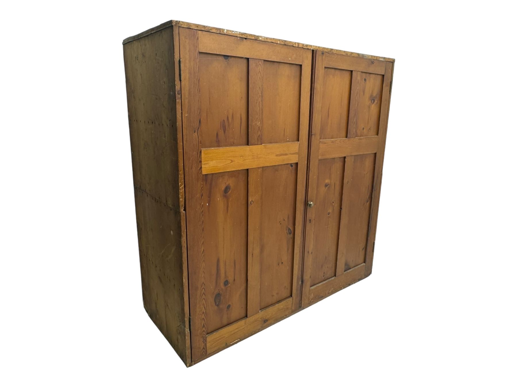 Large 19th century pine cupboard, rectangular top over two panelled later doors, enclosing four open shelves, on plinth base