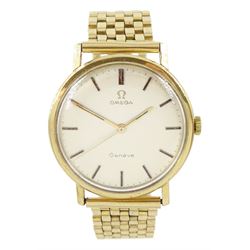 Omega Genève gentleman's 9ct gold wristwatch, silvered dial with baton hour markers, on 9c...