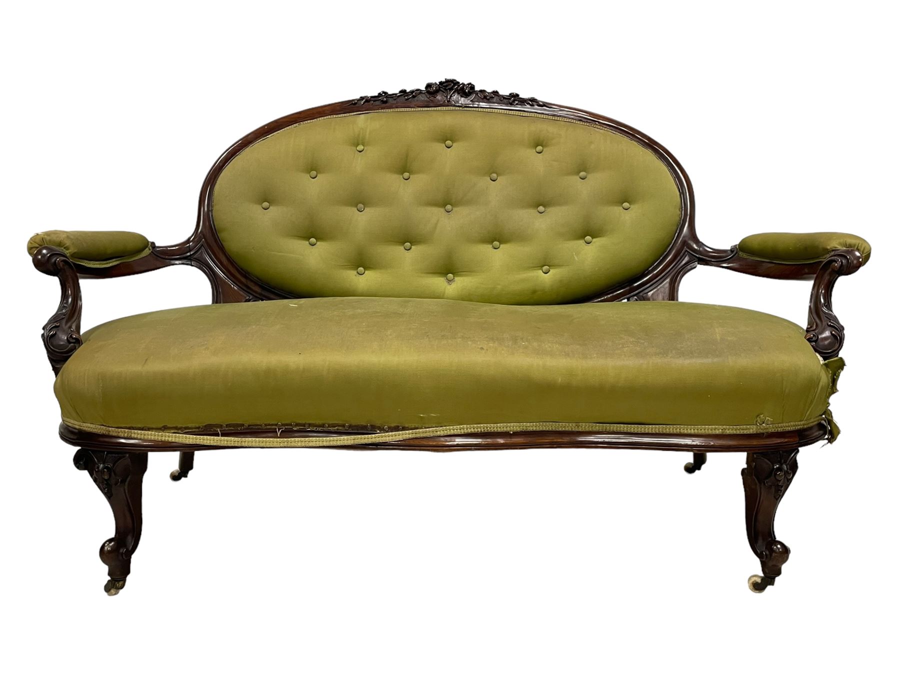 Victorian carved walnut framed two seat settee, cresting rail carved and moulded with a posy of roses and trailing foliate, over an oval back with scrolled arm terminals, serpentine fronted seat over cabriole supports with bell-flower carved knees, buttoned back and sprung seat upholstered in olive green fabric