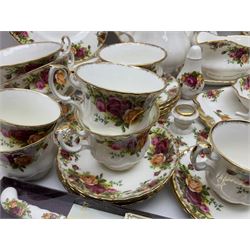 Royal Albert Old Country Roses pattern coffee service for six, comprising coffee pot, milk jug, cups and saucers, cake plate, together with miniature teapot, six teacups and saucers, six dinner plates, six side plates etc 