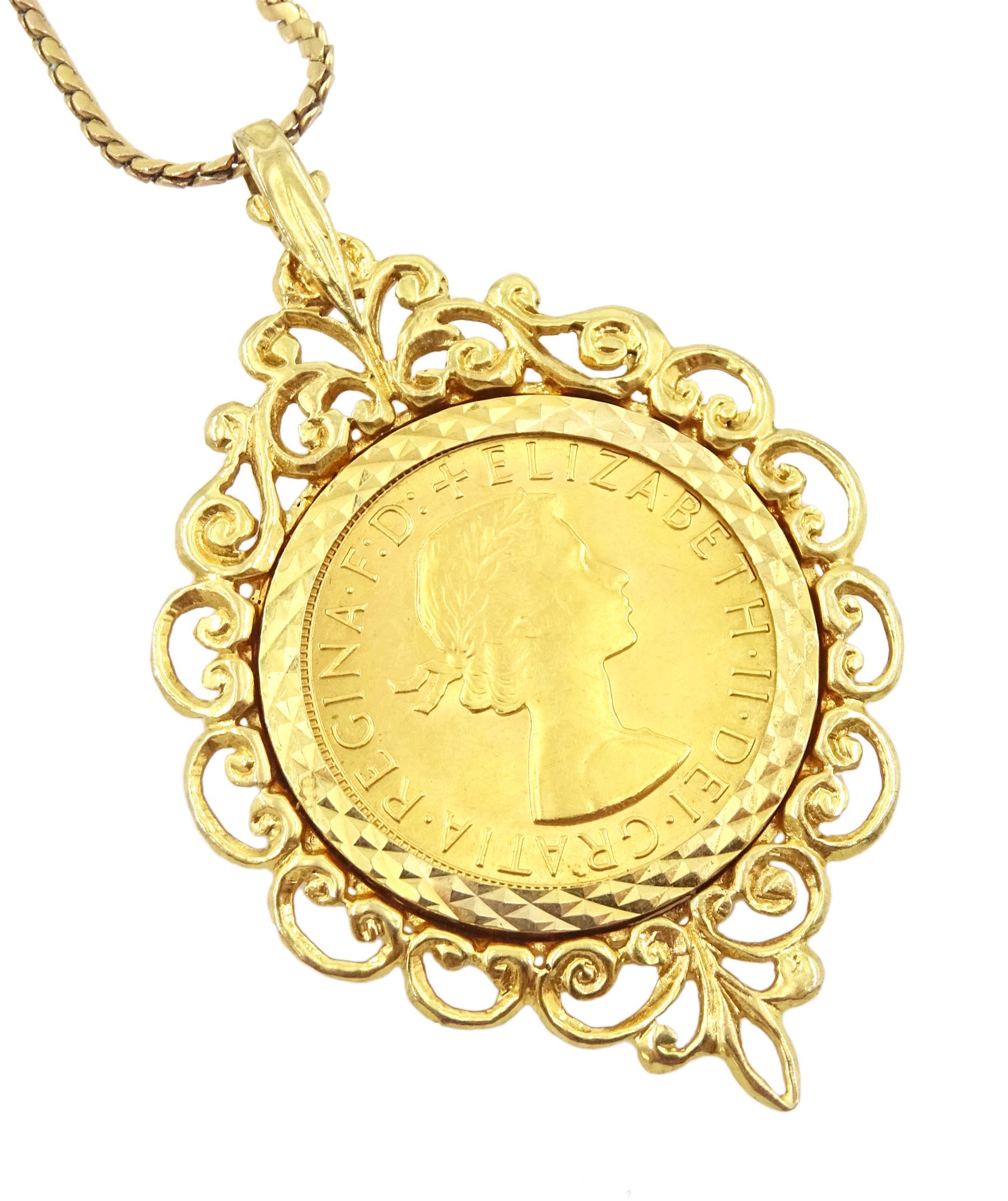 Queen Elizabeth II 1968 gold full sovereign coin, loose mounted in gold pendant, on gold flattened link chain necklace, both hallmarked 9ct