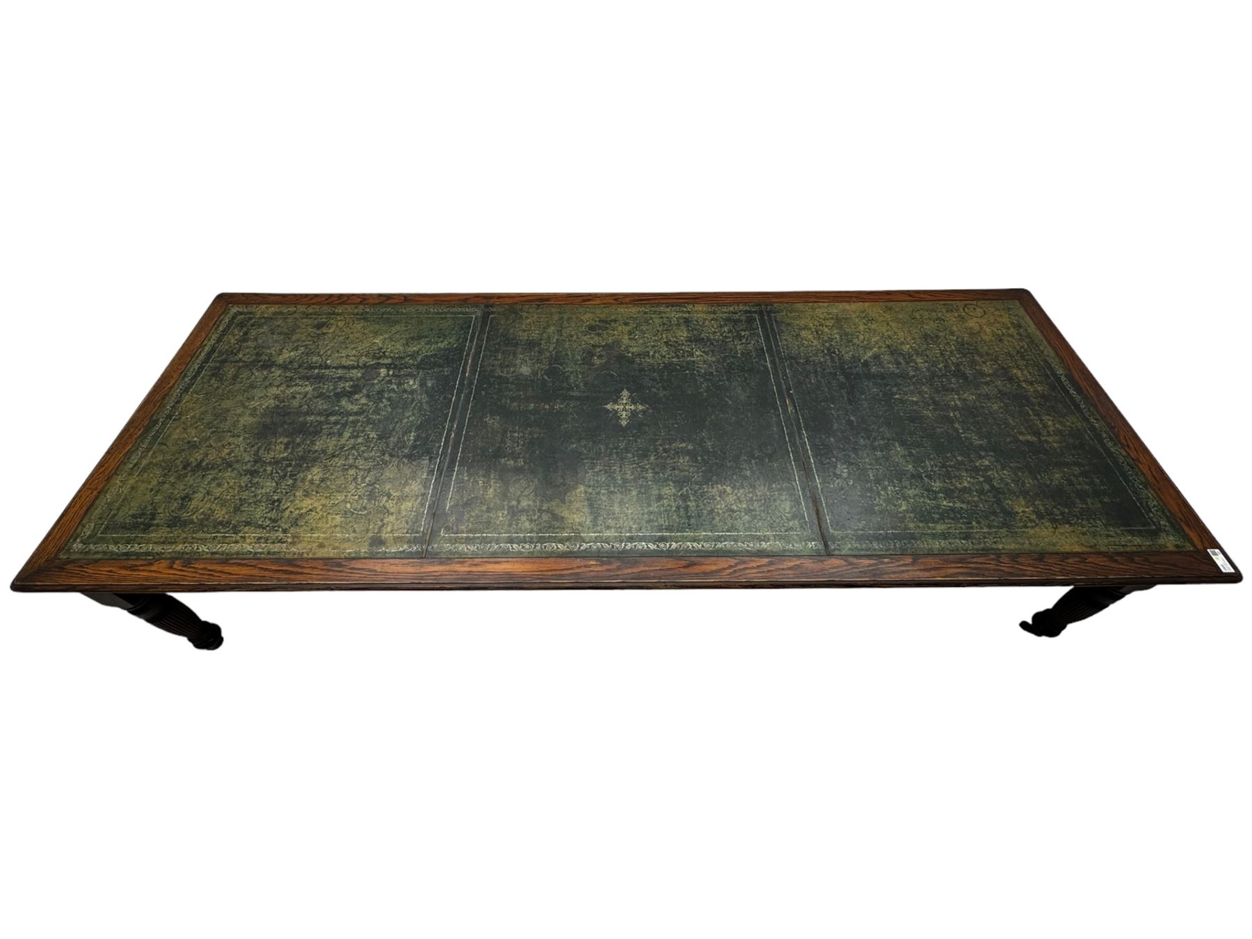 Large 10' 7'' late Victorian oak boardroom table, moulded rectangular top with inset green leather surface, on turned and reed moulded supports with brass and ceramic castors 