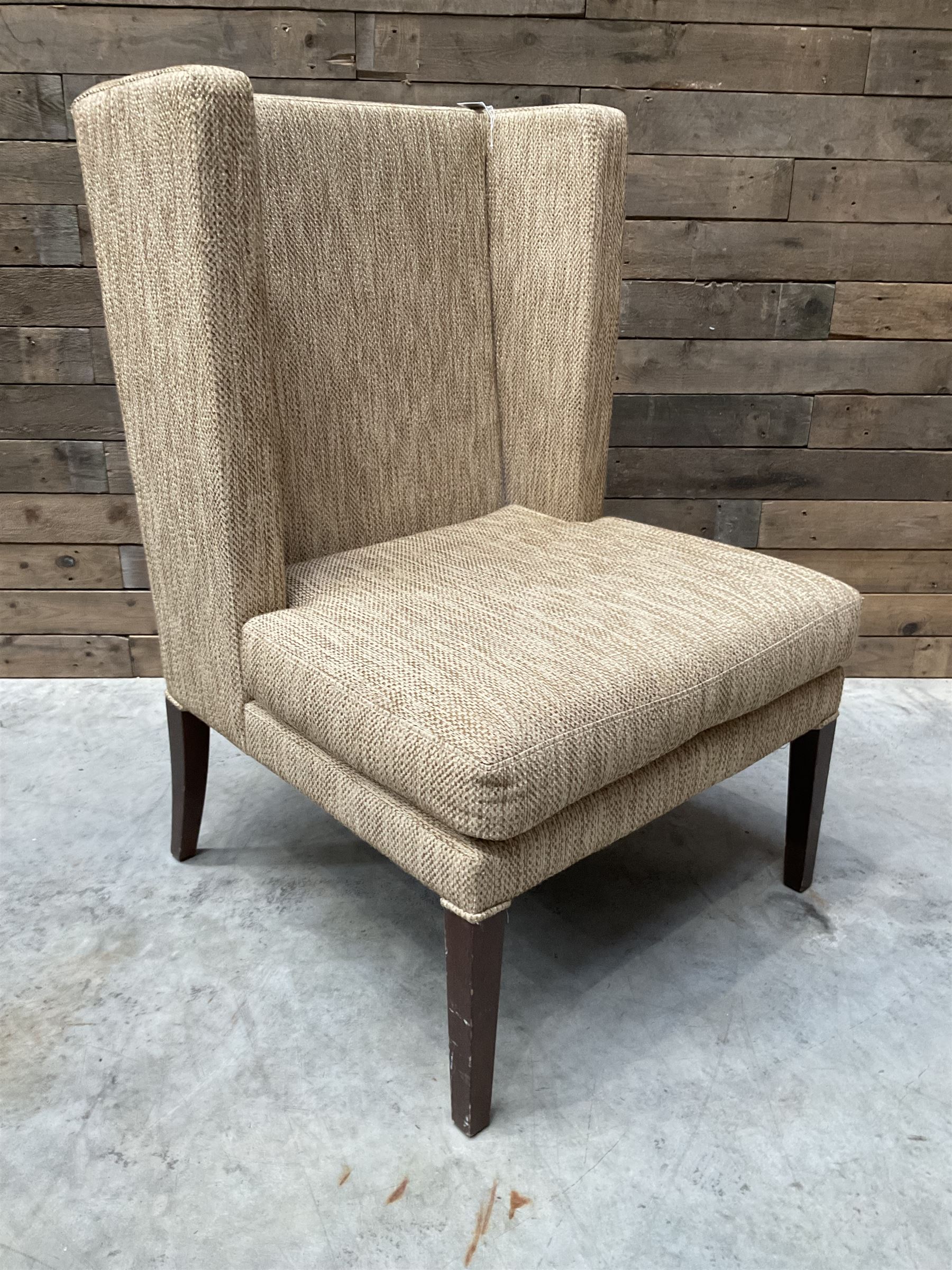 High wing back armchair, upholstered in oatmeal fabric