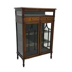 Edwardian mahogany bijouterie display cabinet, featuring satinwood inlay and crossbanding, hinged glazed top fitted with two banded drawers, over two astragal glazed doors enclosing black wool baize lined shelves with gold trim, supported by spade feet