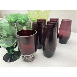 Set of four Swedish Reijmyre drinking glasses, with textured outer surface, together with green drinking glasses including Holmegaard examples and other glassware