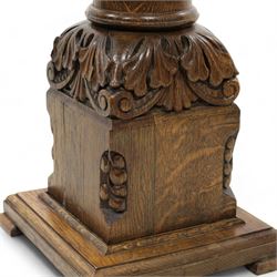 Early 20th century carved oak ecclesiastical baptismal font, circular dished top with hexagonal edge carved with Yorkshire rose and lettering, turned pedestal with acanthus carved decoration, on square base with ogee feet